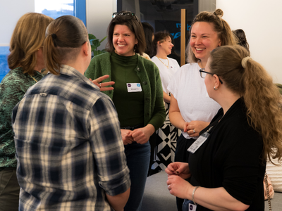 Women chatting at business event